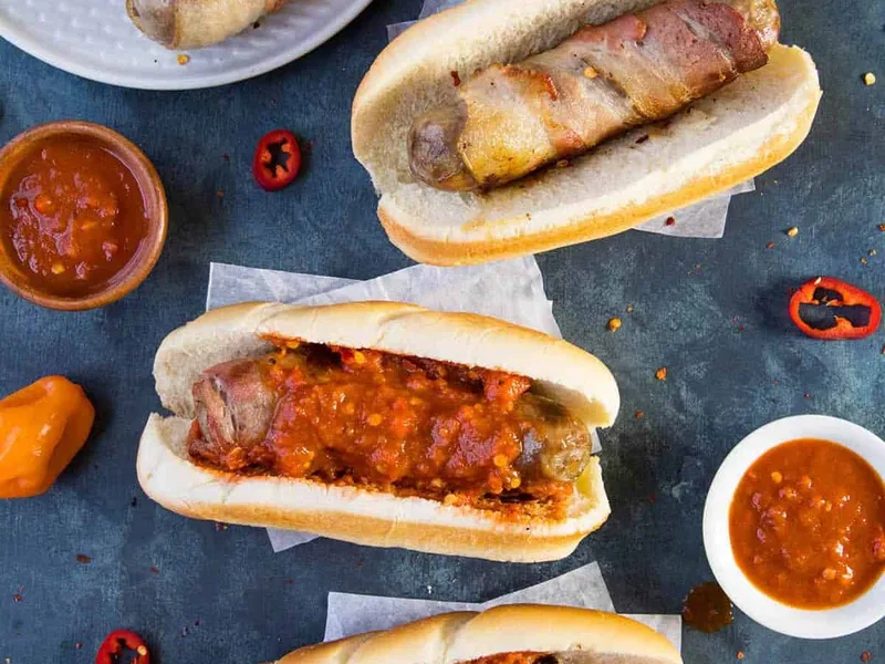 Bacon Wrapped Beer Brats with Spicy Habanero Sauce