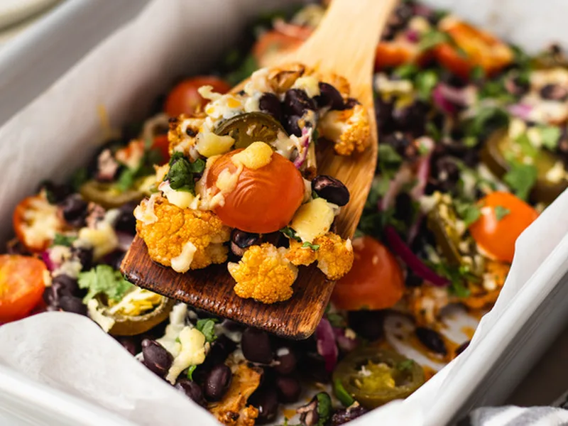 Loaded Cauliflower Nachos with Black Beans and Cheddar