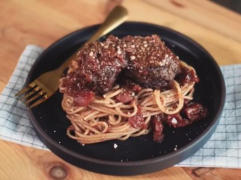 Plant-Based Meatballs in Rich Tomato Wine Sauce with Pasta