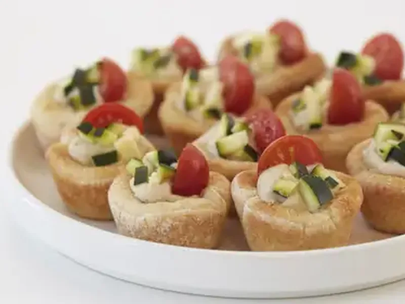 Baked Pizza Dough Hummus Cups with Fresh Zucchini and Tomato