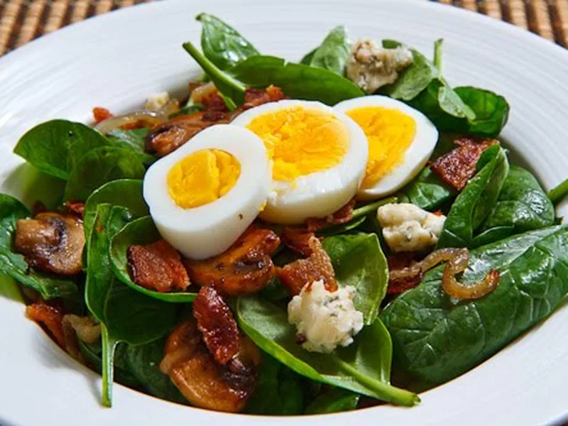 Warm Spinach Salad with Bacon, Caramelized Onions and Blue Cheese