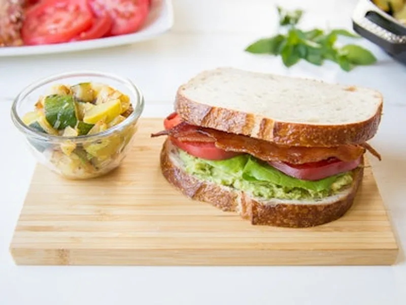 Fresh Avocado Tomato Hummus Sandwich with Sautéed Squash